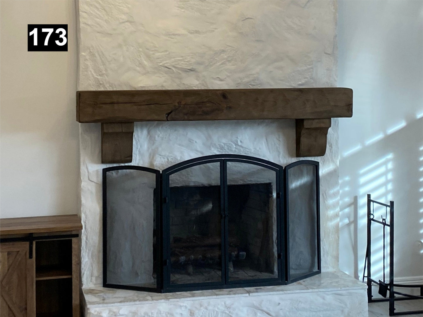 Custom reclaimed wood beam fireplace mantel with corbels