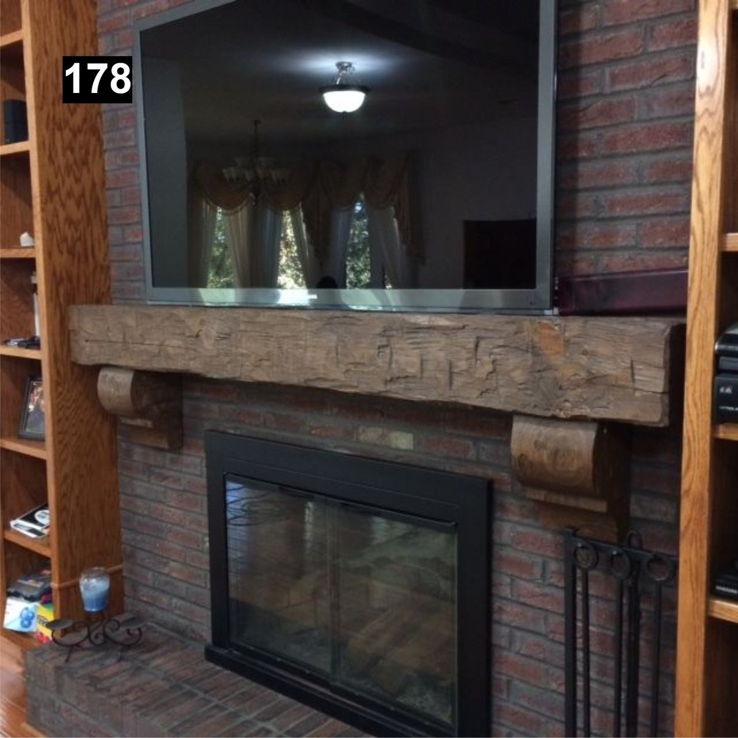 Custom reclaimed wood beam fireplace mantel with corbels